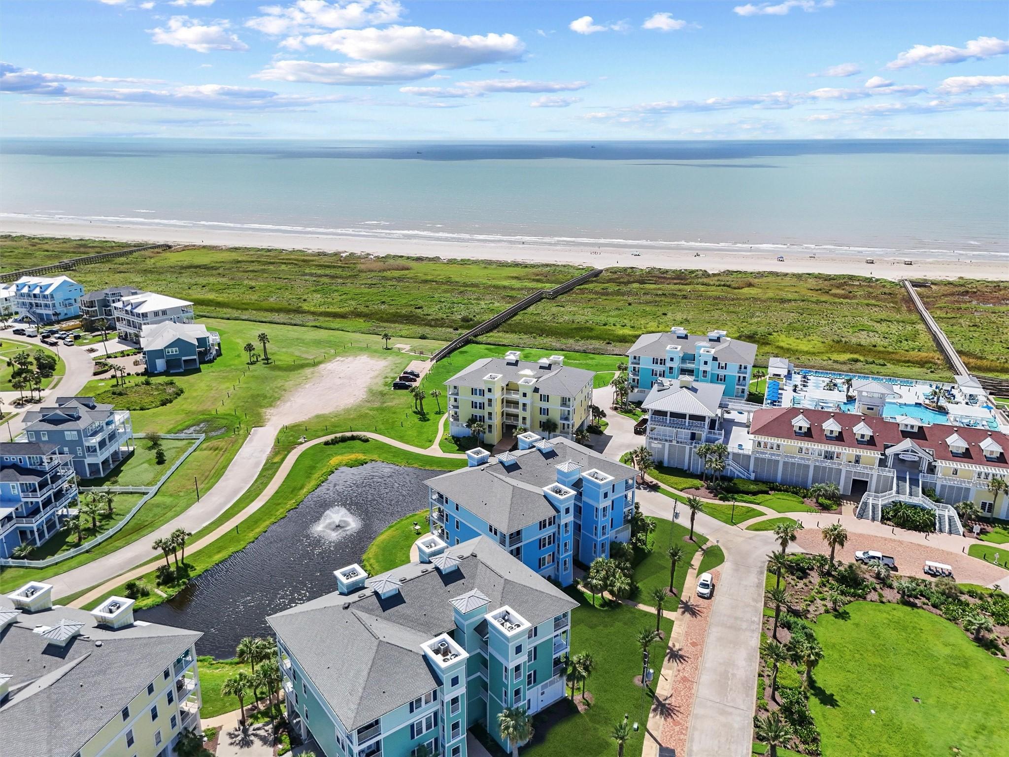 Image 2: This vibrant coastal condo offers resort-style liv