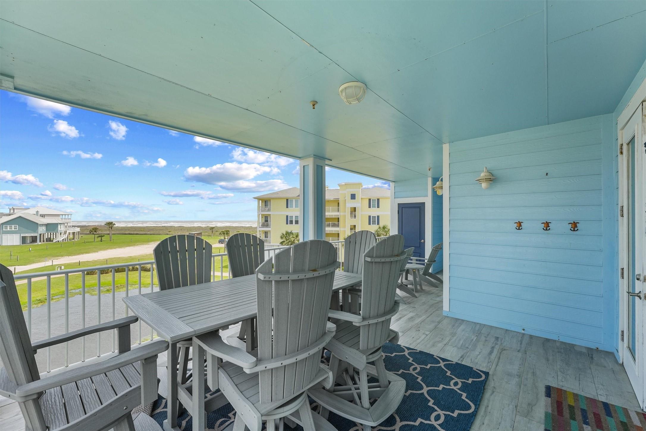 Image 3: This spacious covered balcony offers peaceful view