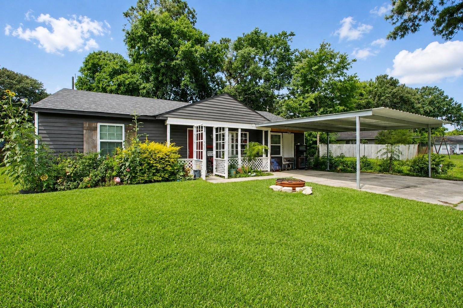 Image 2: Classic single-story home featuring an expansive f