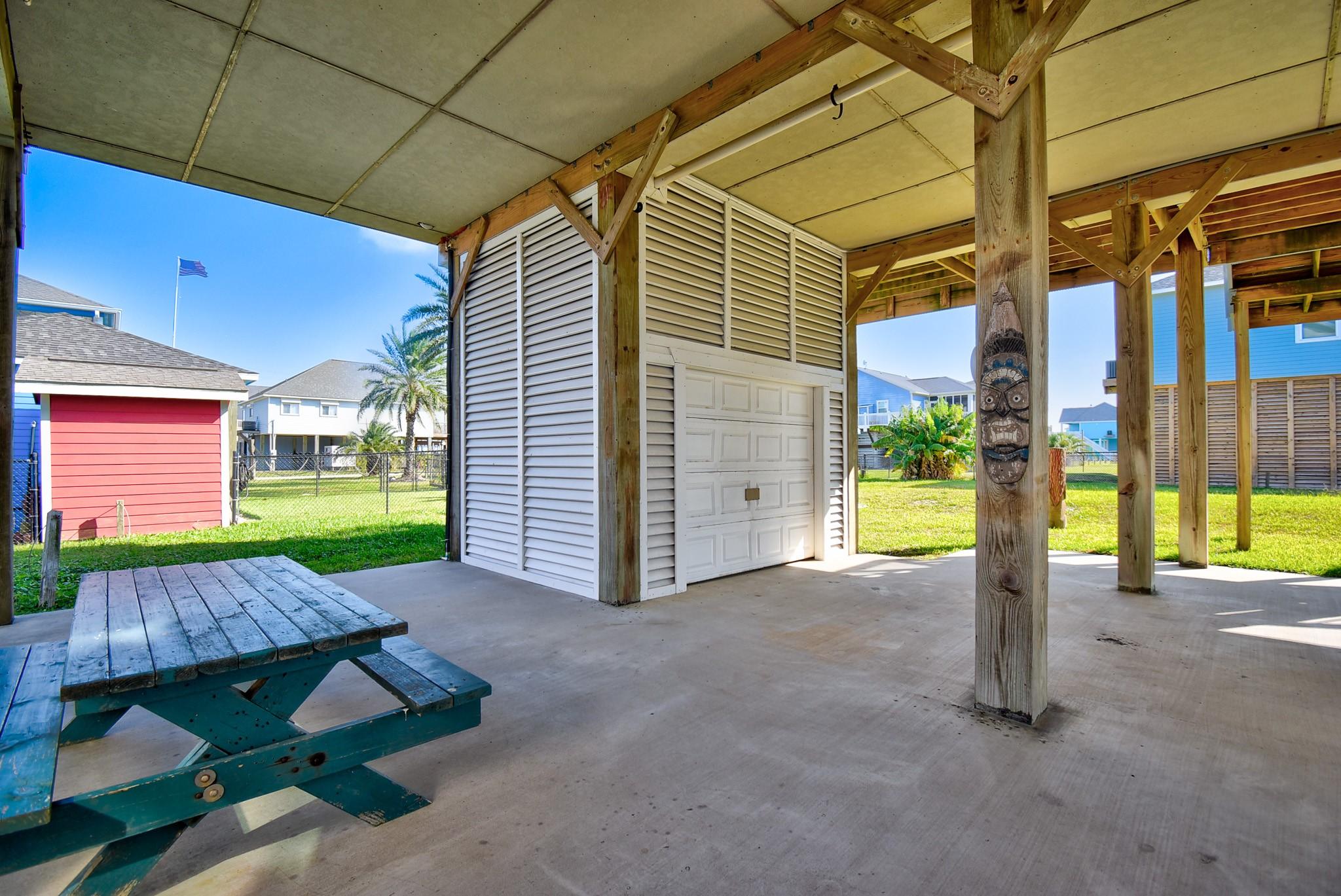 Image 4: Large covered space beneath the home with golf car