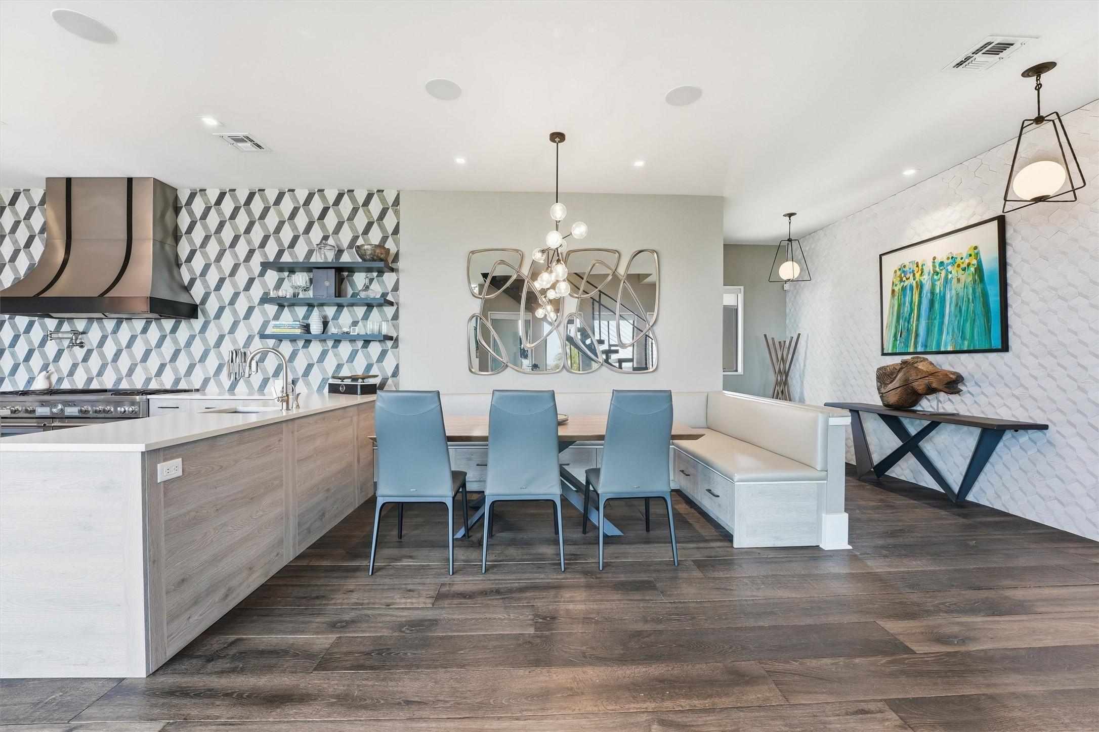 Image 4: Elegant dining area featuring a custom built-in be