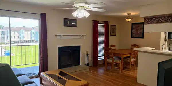 Image 3: Living room with wood burning fireplace