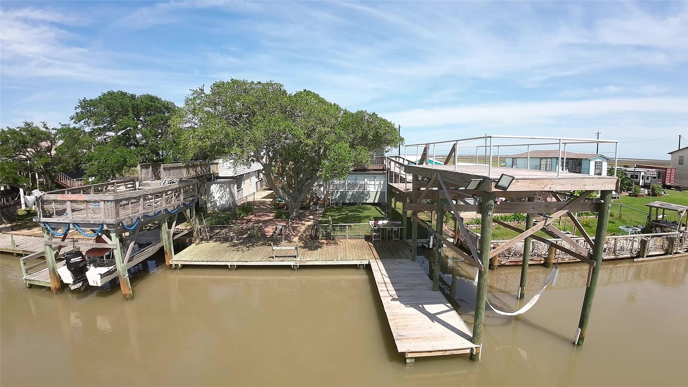 Image 1: Overview of house and dock areas from river.
