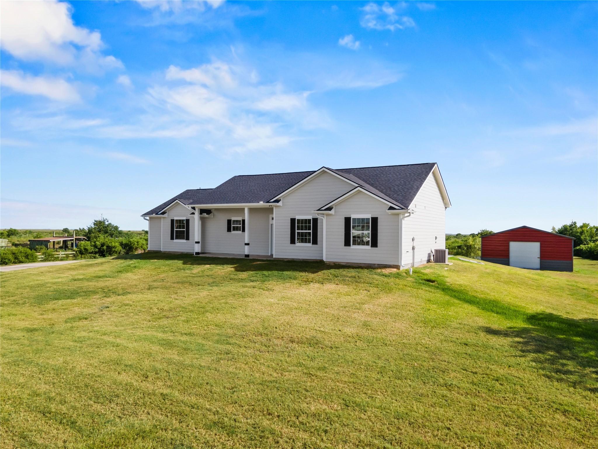 Image 1: Spacious yard with a charming home and a versatile