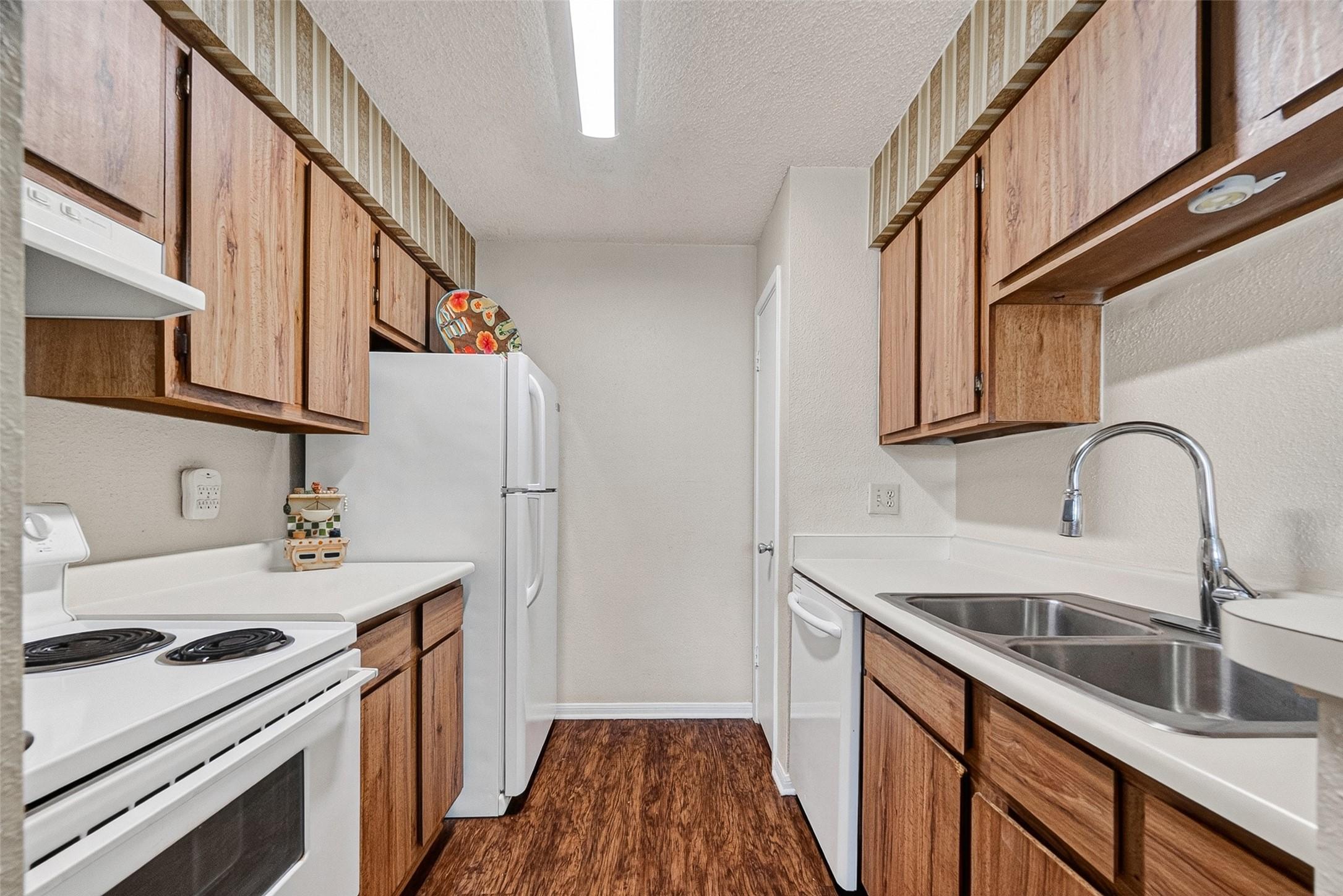 Image 2: Warm, neutral kitchen with pantry. Fridge included