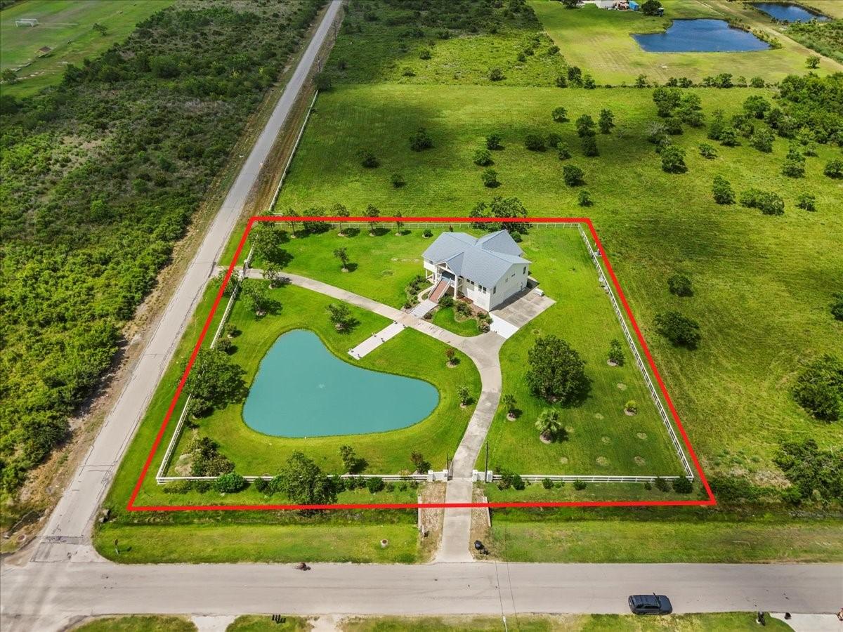 Image 1: 8.25 Acres behind red line.