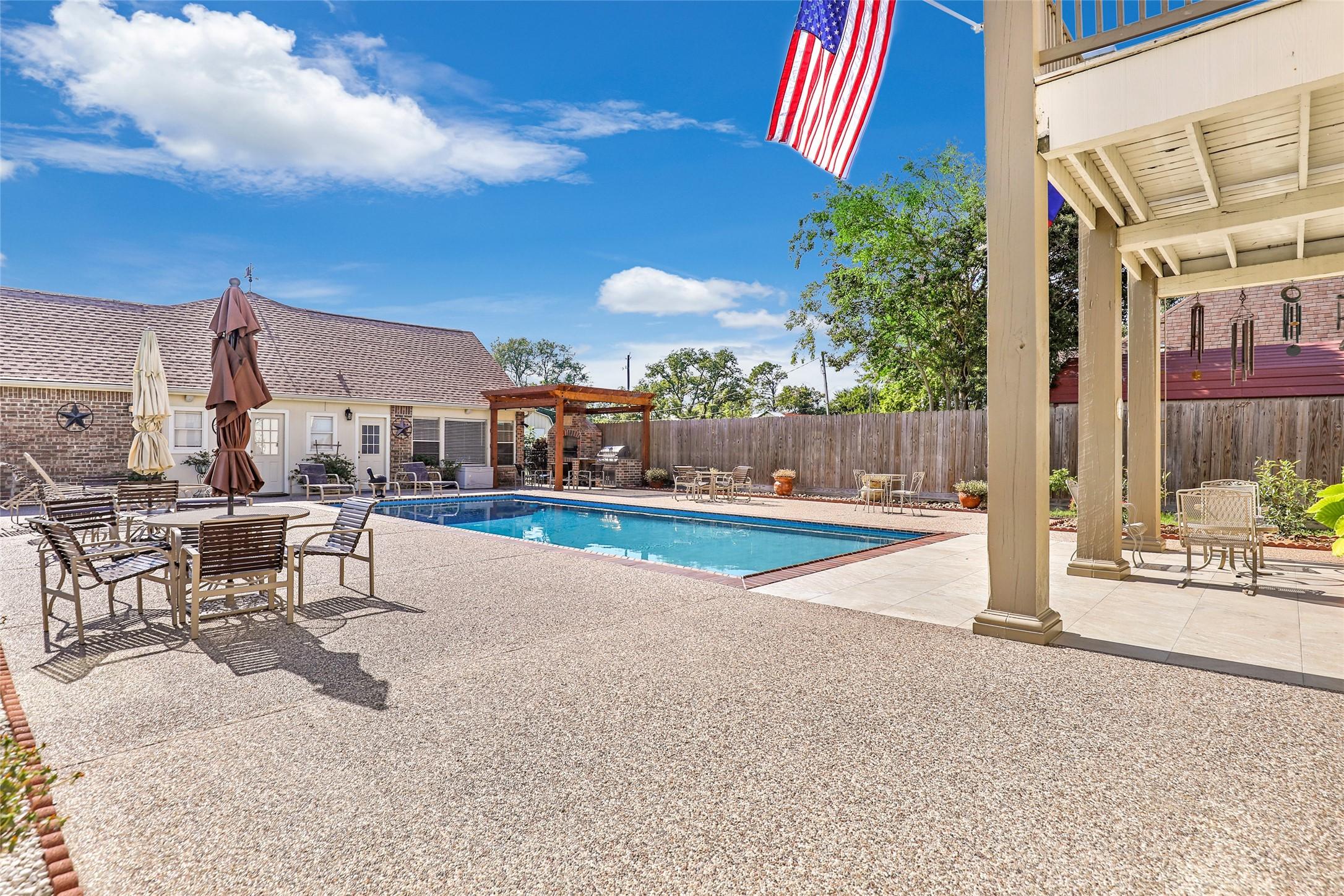 Image 3: Pool area off pool house and home and covered pati