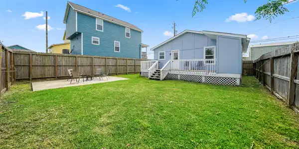 Image 3: Fully fenced backyard offering privacy and space t