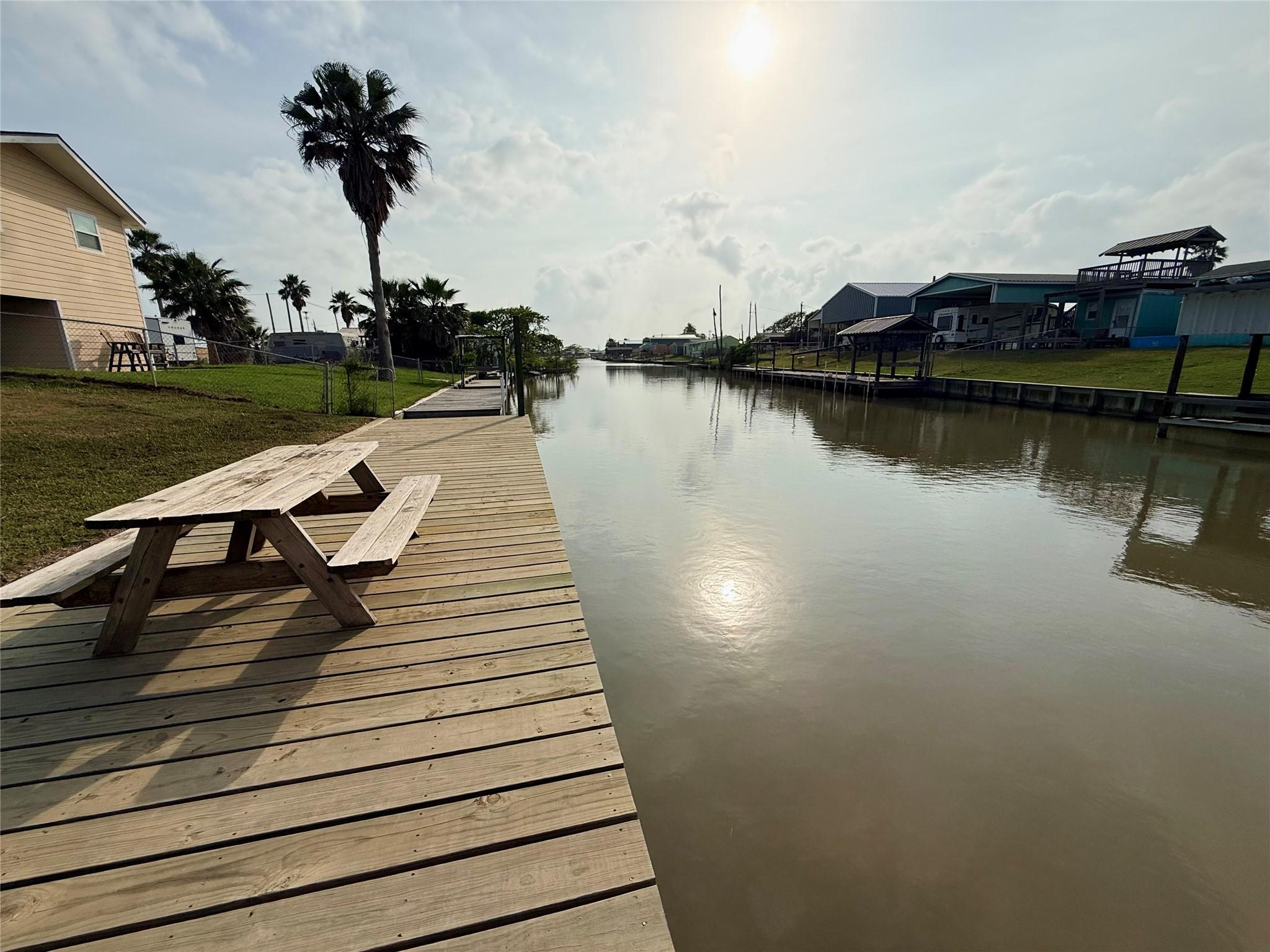 Image 1: Serene westward view on canal.