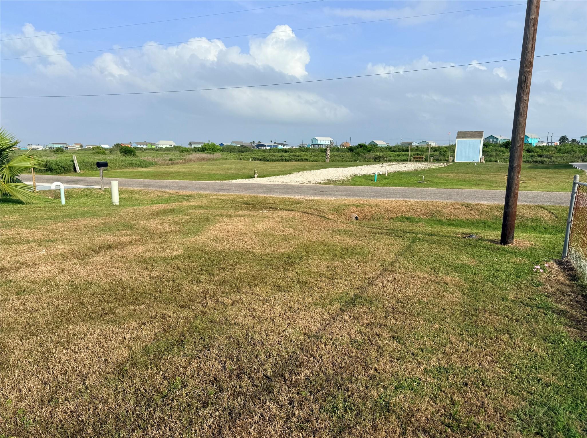 Image 3: Grassy high lot with utilities installed including