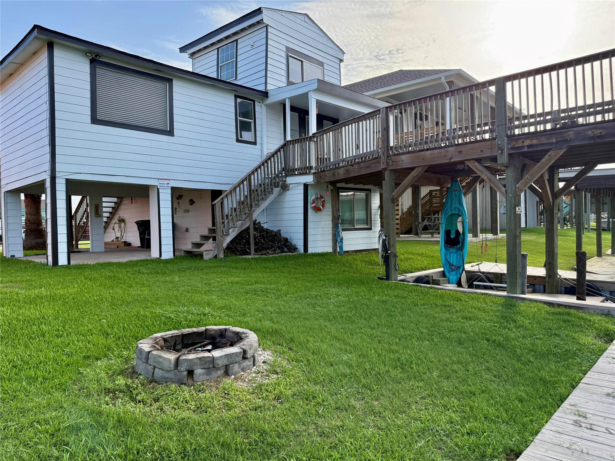 Image 1: Canal front home with elevated deck to allow for a