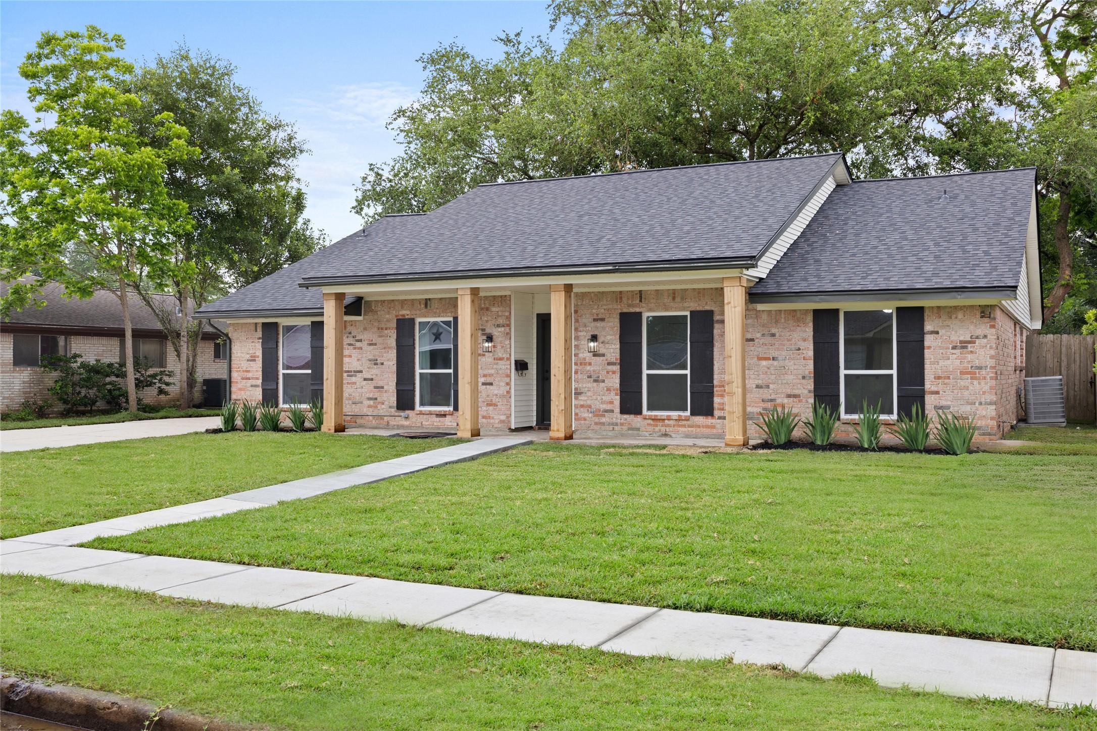 Image 2: The picture perfect exterior with a front porch vi