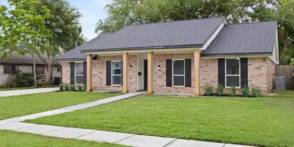 Image 2: The picture perfect exterior with a front porch vi