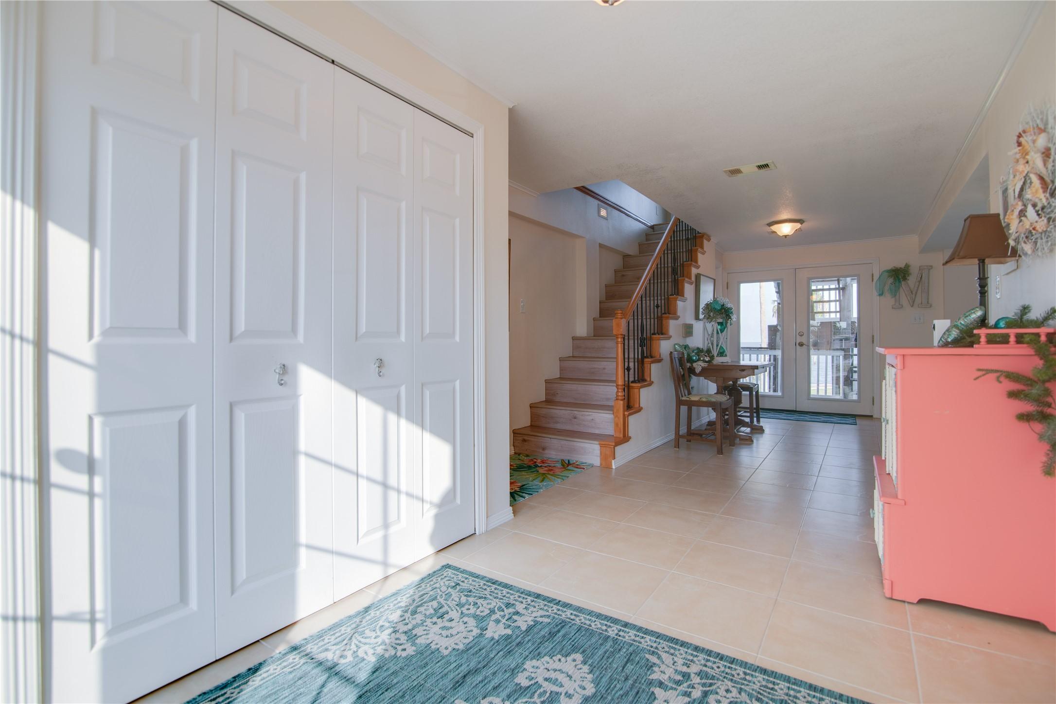 Image 3: Step into a welcoming coastal-inspired entryway wh