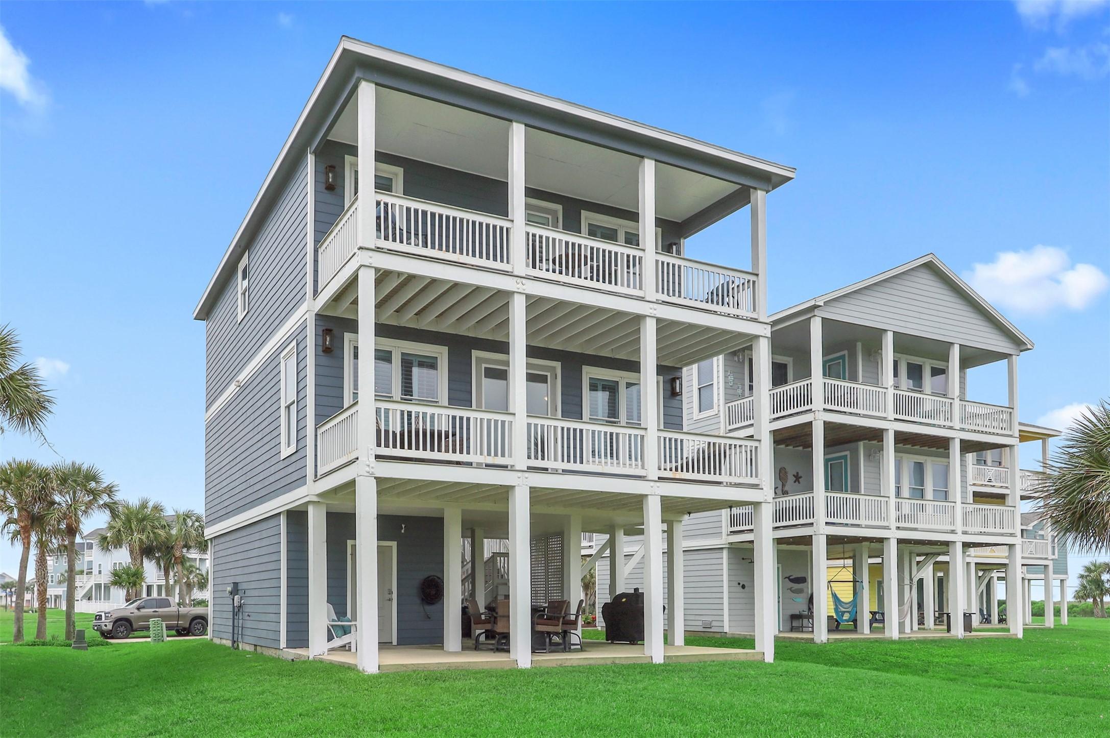 Image 2: Spacious coastal home with expansive covered decks