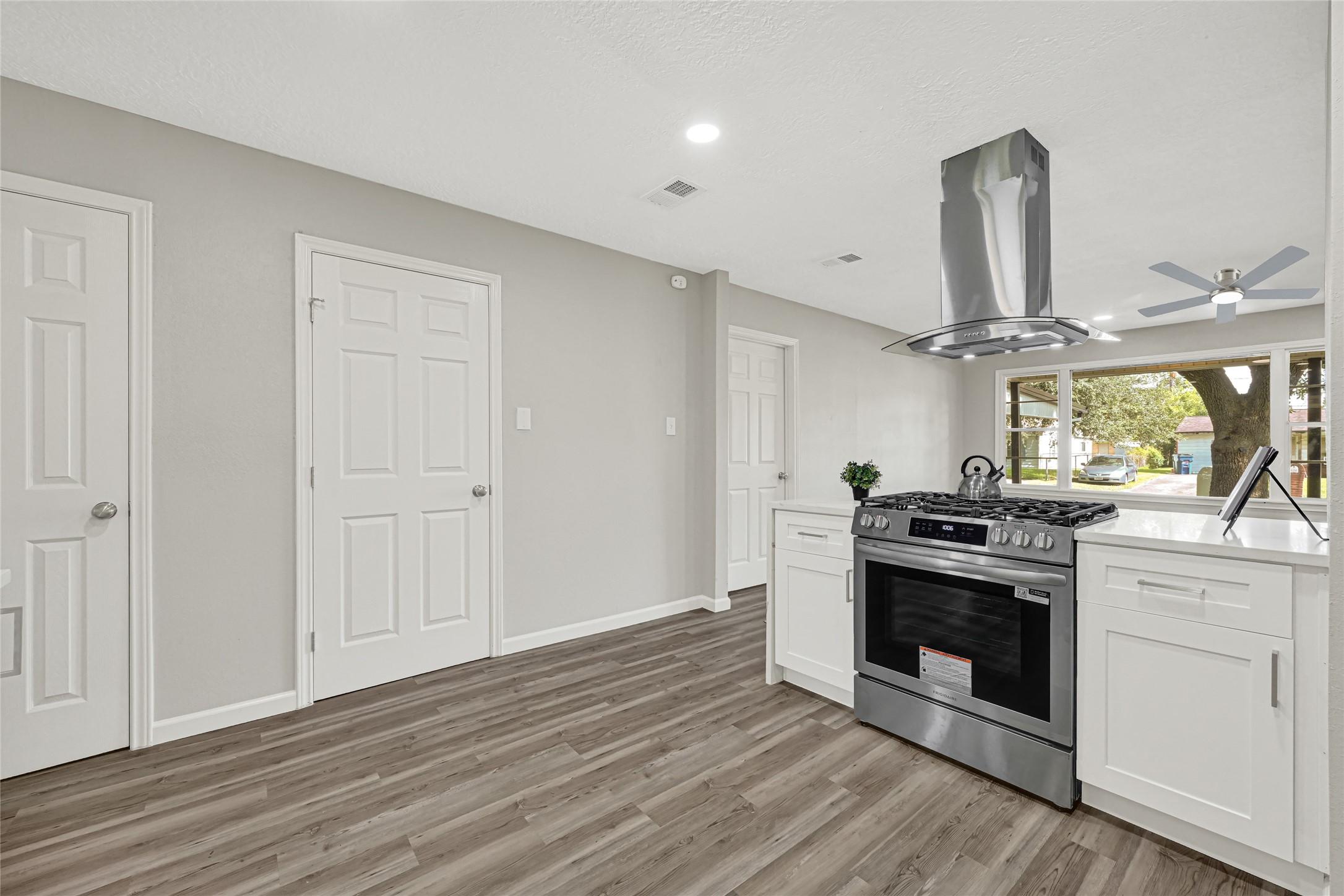 Image 4: Kitchen opens to the spacious living room