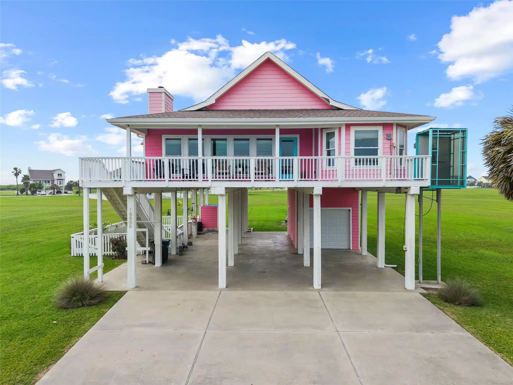 Image 1: This coastal "Pink House" retreat sits on an expan