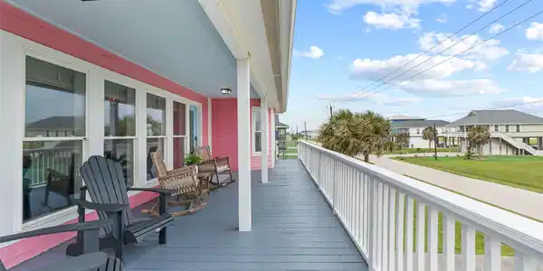 Image 2: This inviting home features a spacious, full lengt