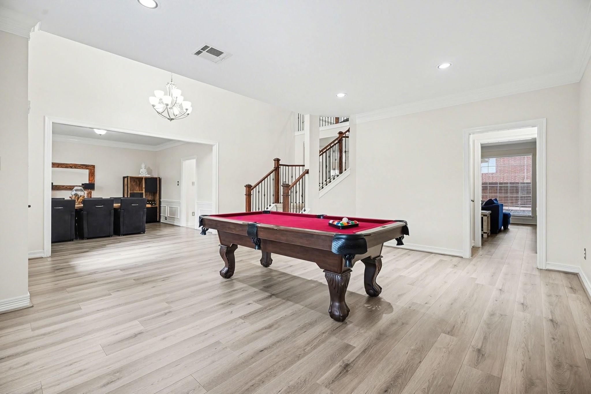 Image 4: Spacious open-concept room with luxury vinyl floor
