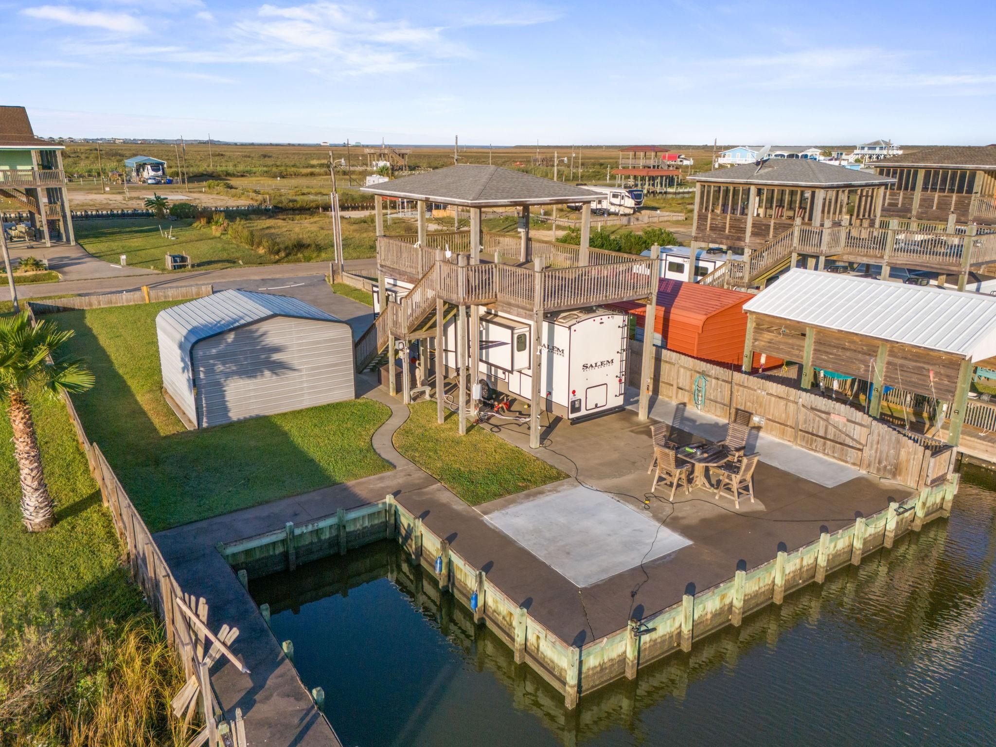 Image 2: A stunning areal view showcasing the property's wa