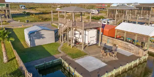 Image 2: A stunning areal view showcasing the property's wa