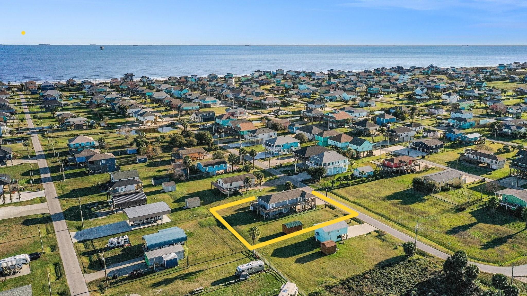 Image 2: GULF VIEW, AND AERIAL VIEW OF THE HOME.