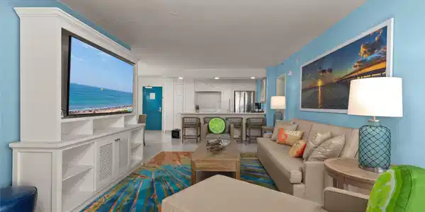 Image 2: Bright, coastal-themed living room with ocean view