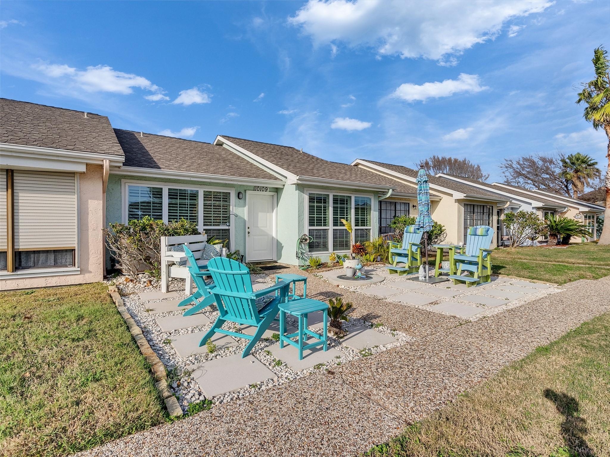 Image 1: Beautiful sitting area out front welcomes you with