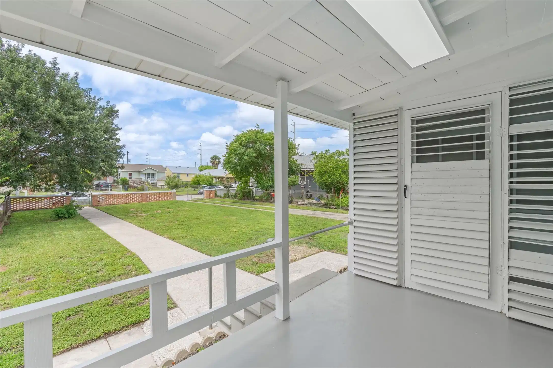 Image 1: Covered front porch for relaxing with friends and