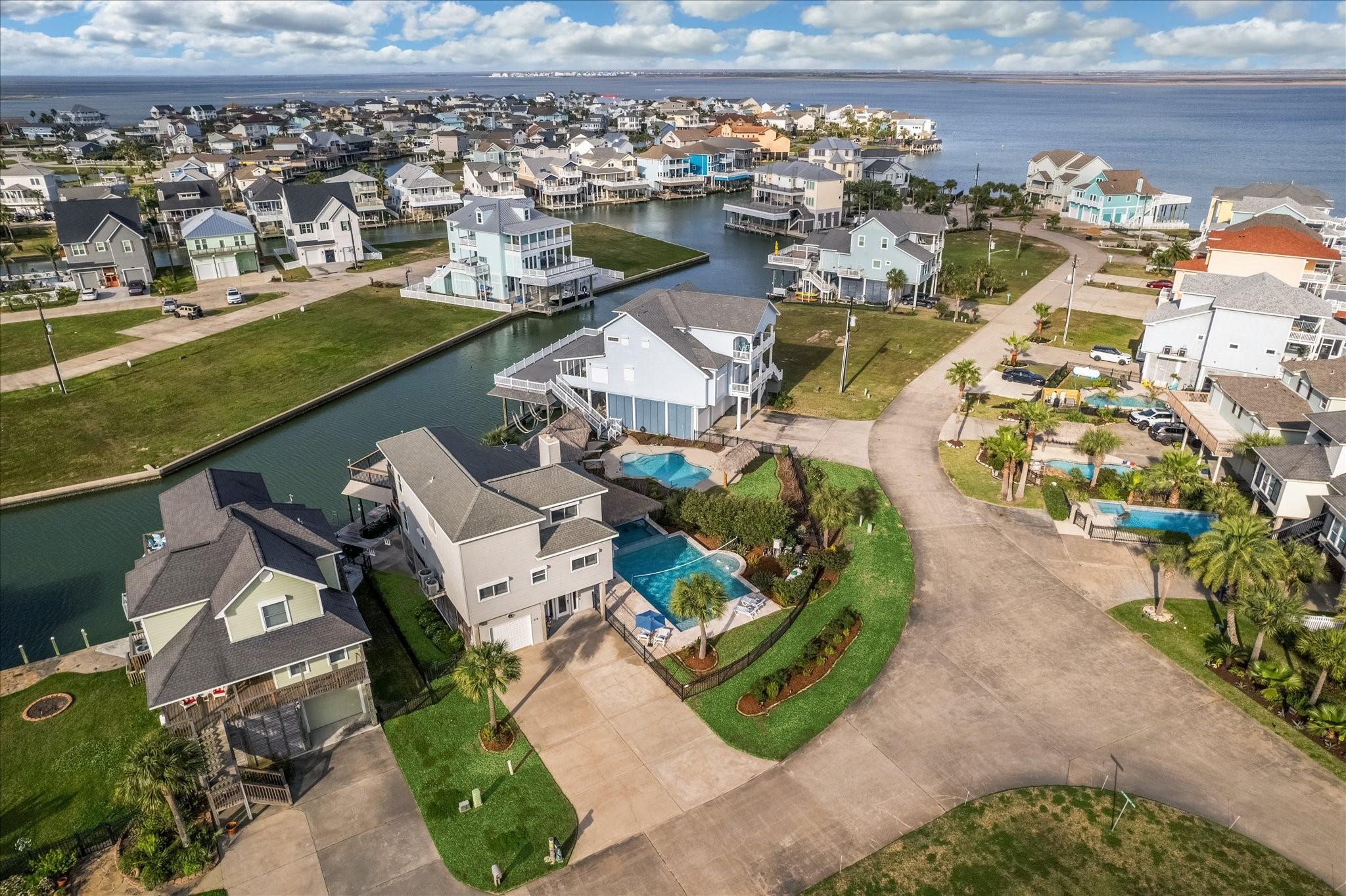 Image 2: Tiki Island features lush landscaping, private dri