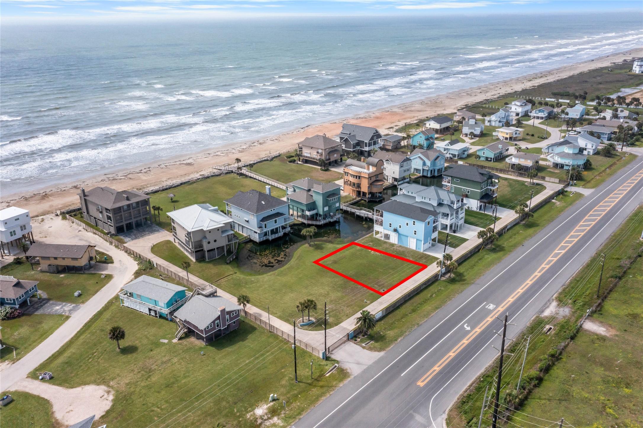 Image 1: Third-row beachside lot with Gulf-facing potential