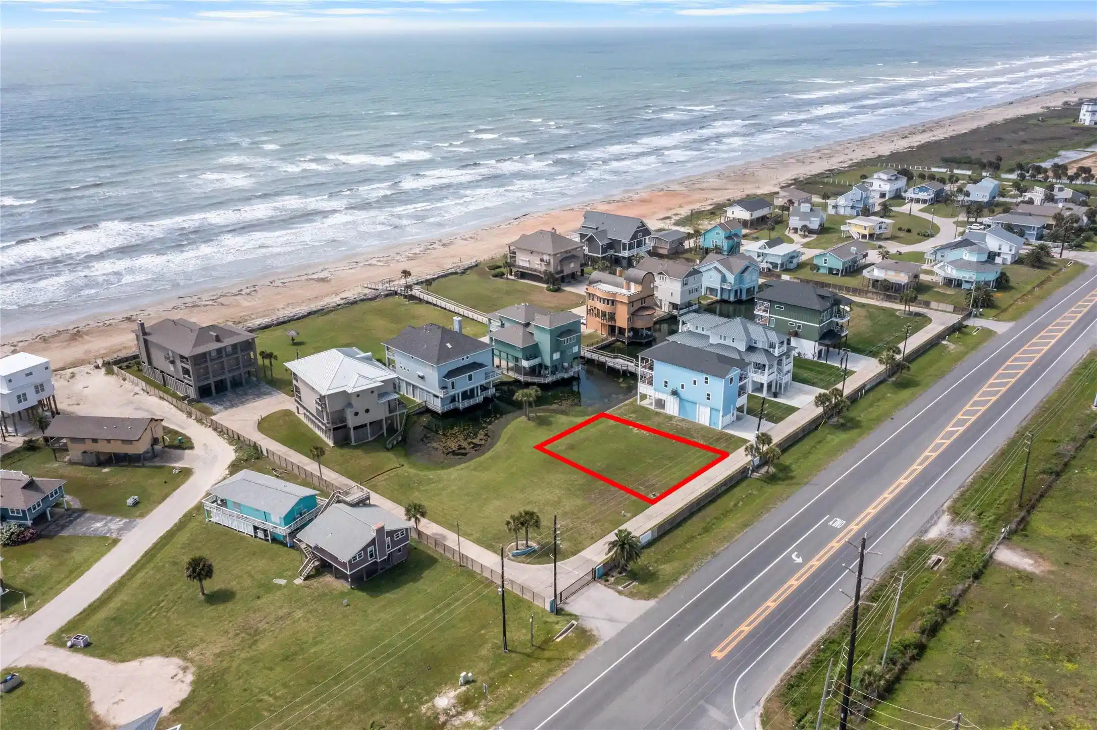 Image 1: Third-row beachside lot with Gulf-facing potential