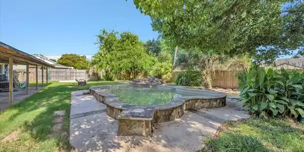 Image 4: Private pool with stone surround, surrounded by ma