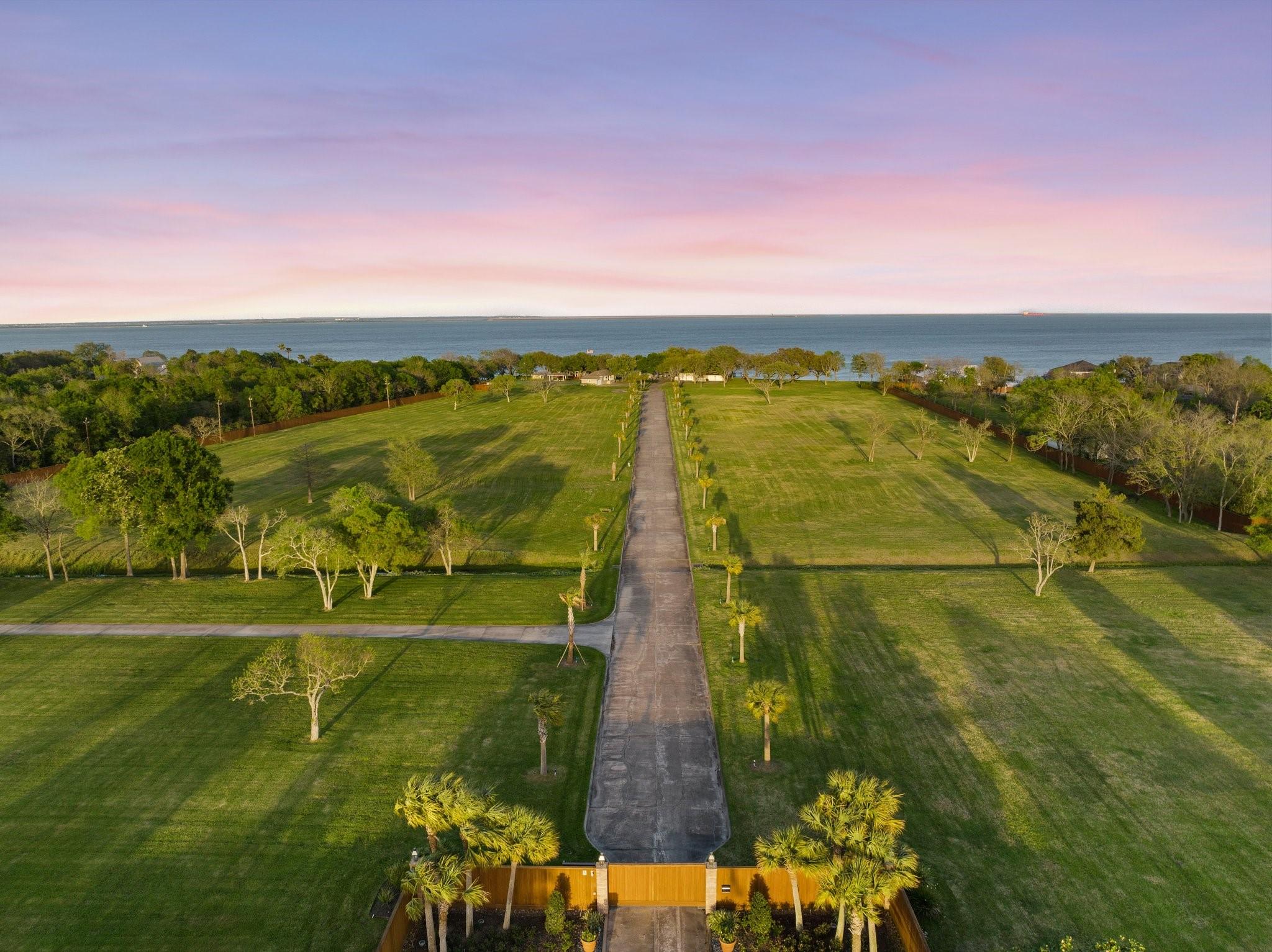 Image 1: Aerial view of property at gated entrance.