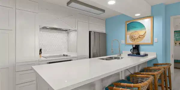 Image 4: This kitchen features a sleek, modern design with