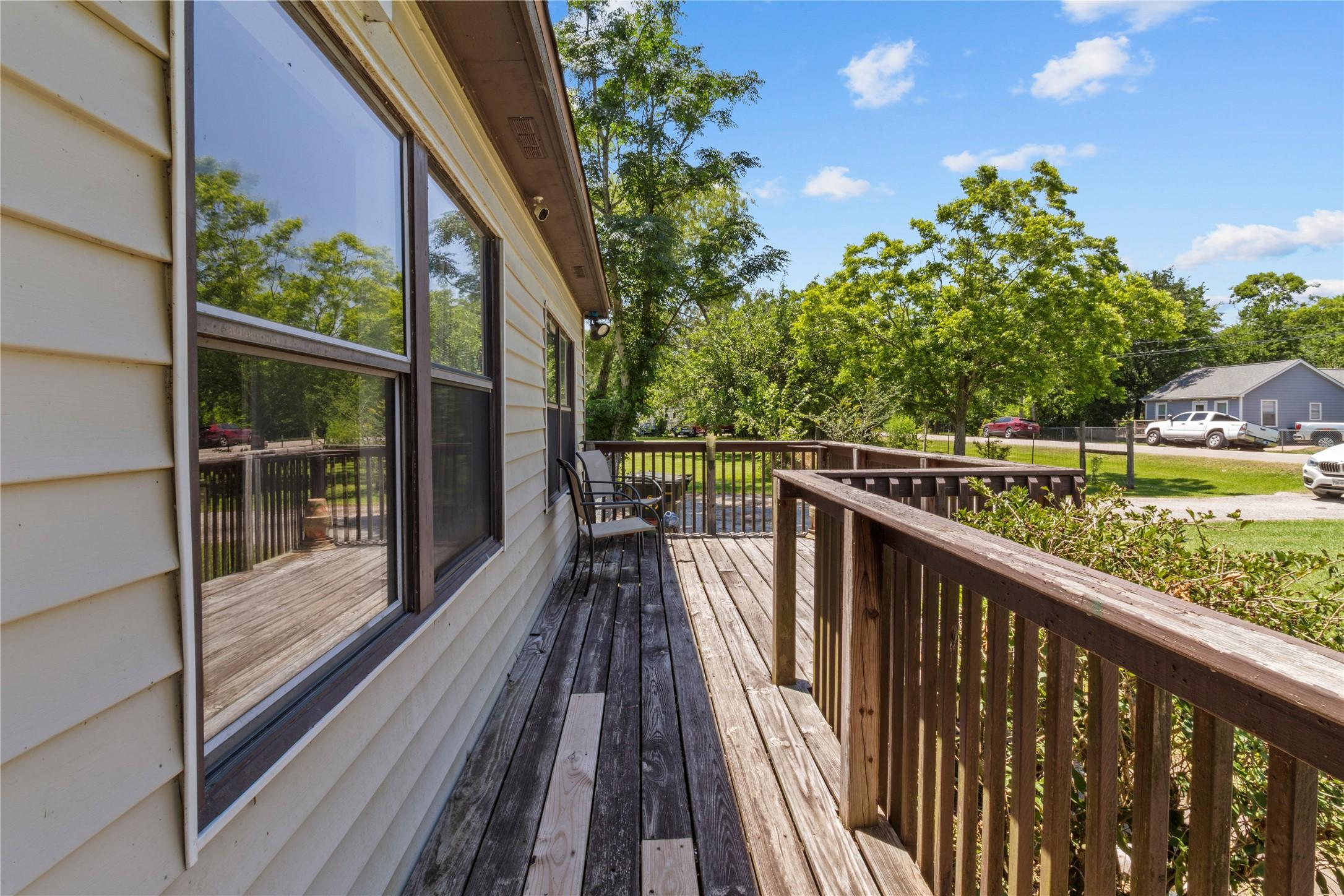 Image 3: This photo showcases a charming wooden deck attach
