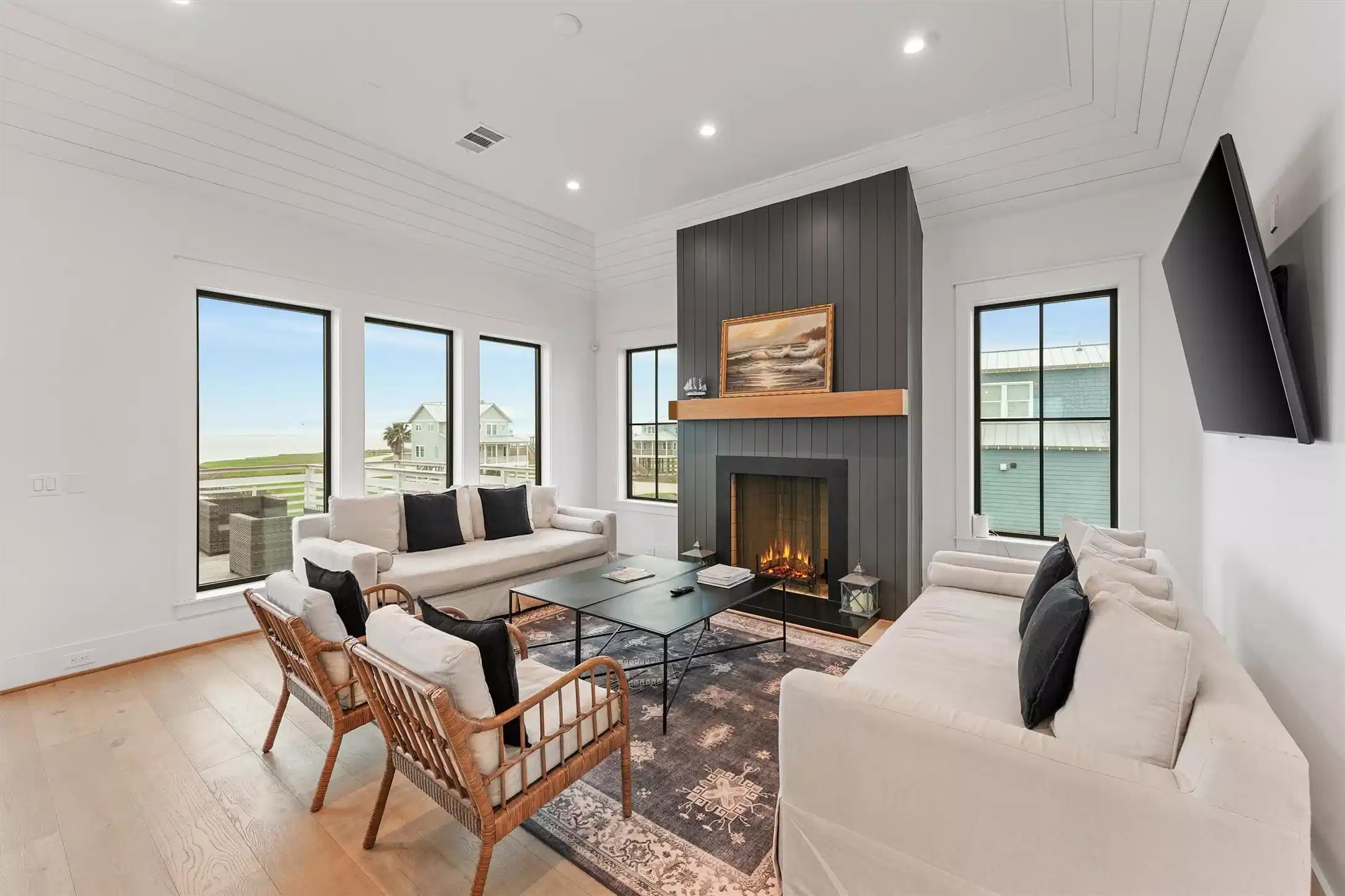 Image 1: Open-concept living space with modern finishes, fi