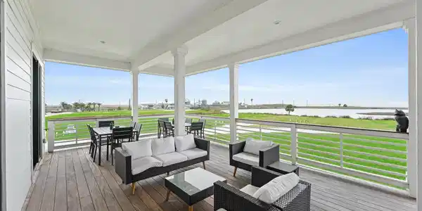 Image 4: Expansive upper deck with panoramic bay views, per