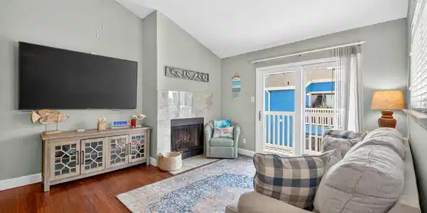 Image 2: Bright and spacious, the living room features soar