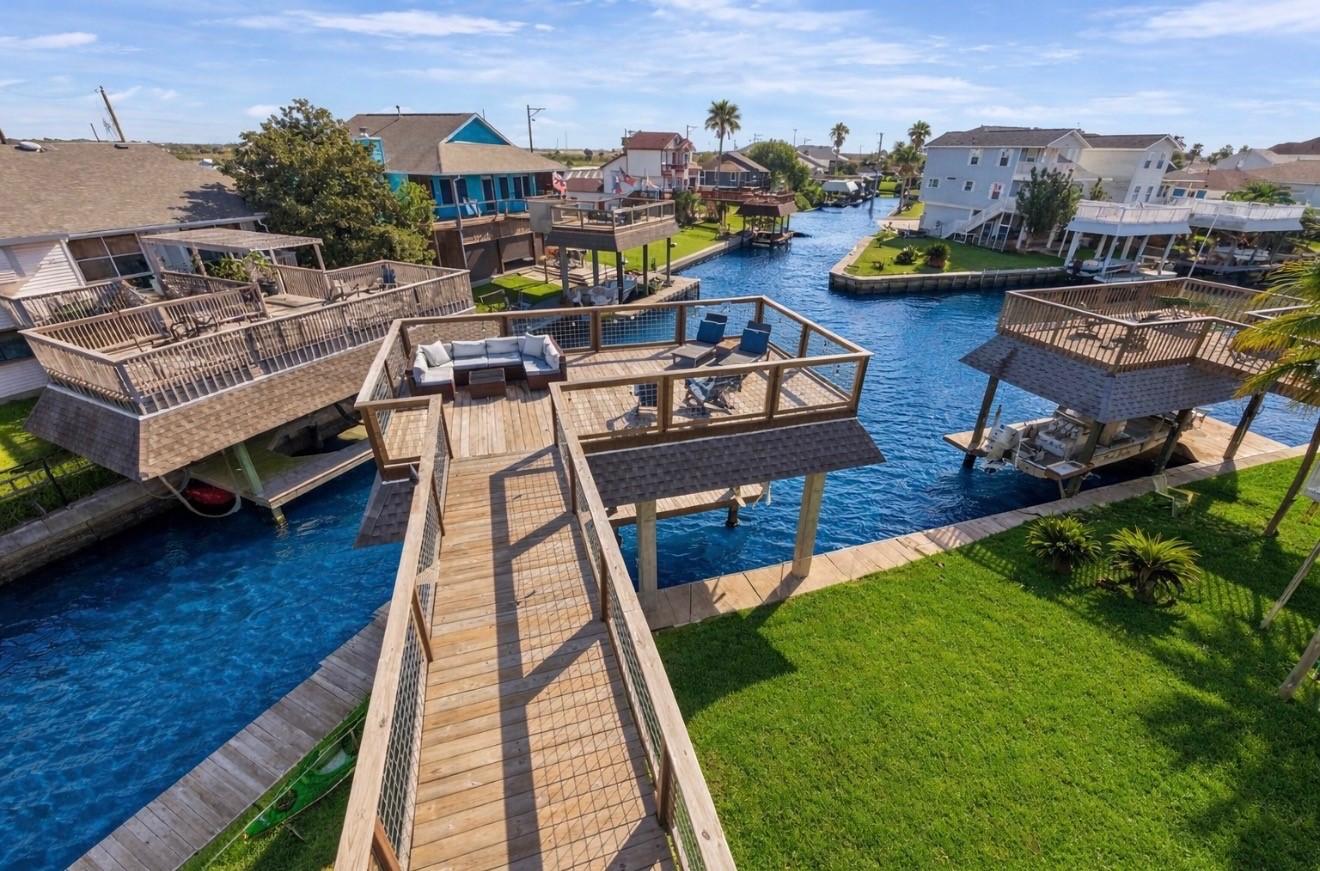 Image 1: Beautiful canal front home with expansive decks an