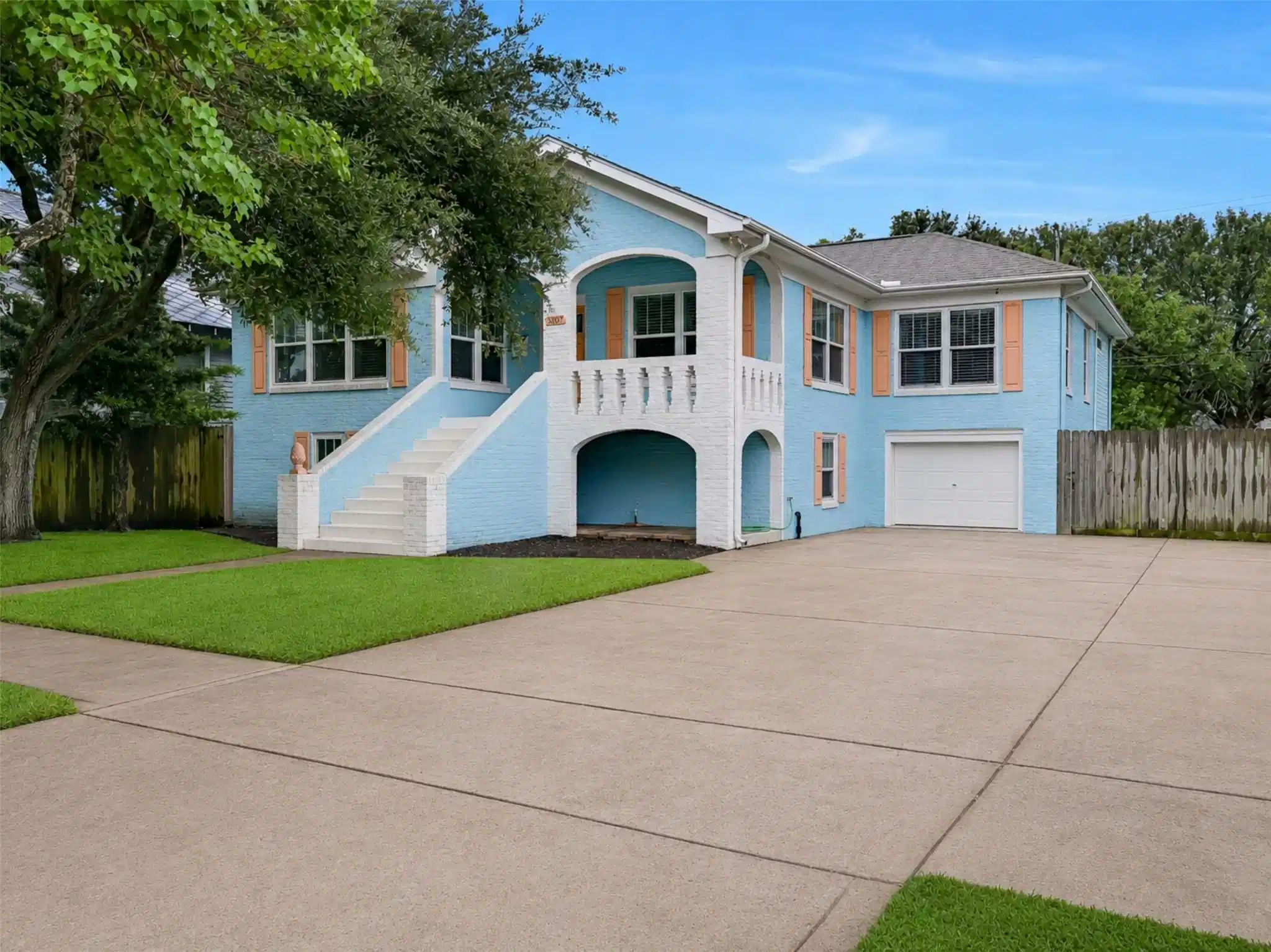 Image 1: A charming front exterior welcomes you home with t