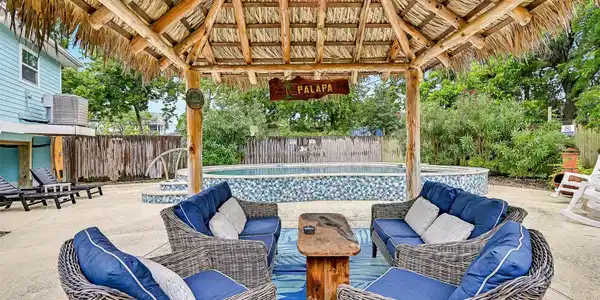 Image 4: The oversized covered patio creates the perfect ou