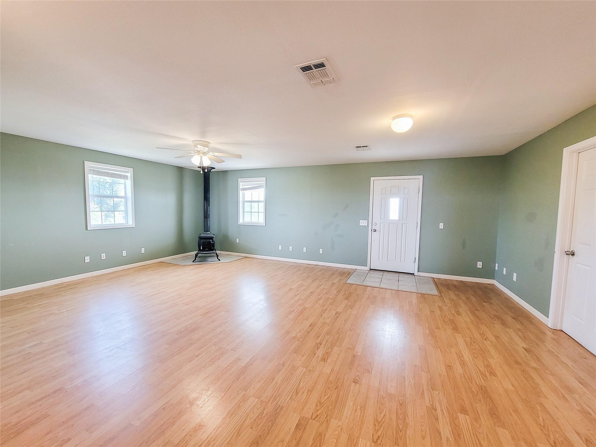 Image 3: Living room with wood burning stove