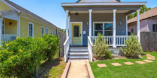 Image 2: Front exterior of the home with great curb appeal,