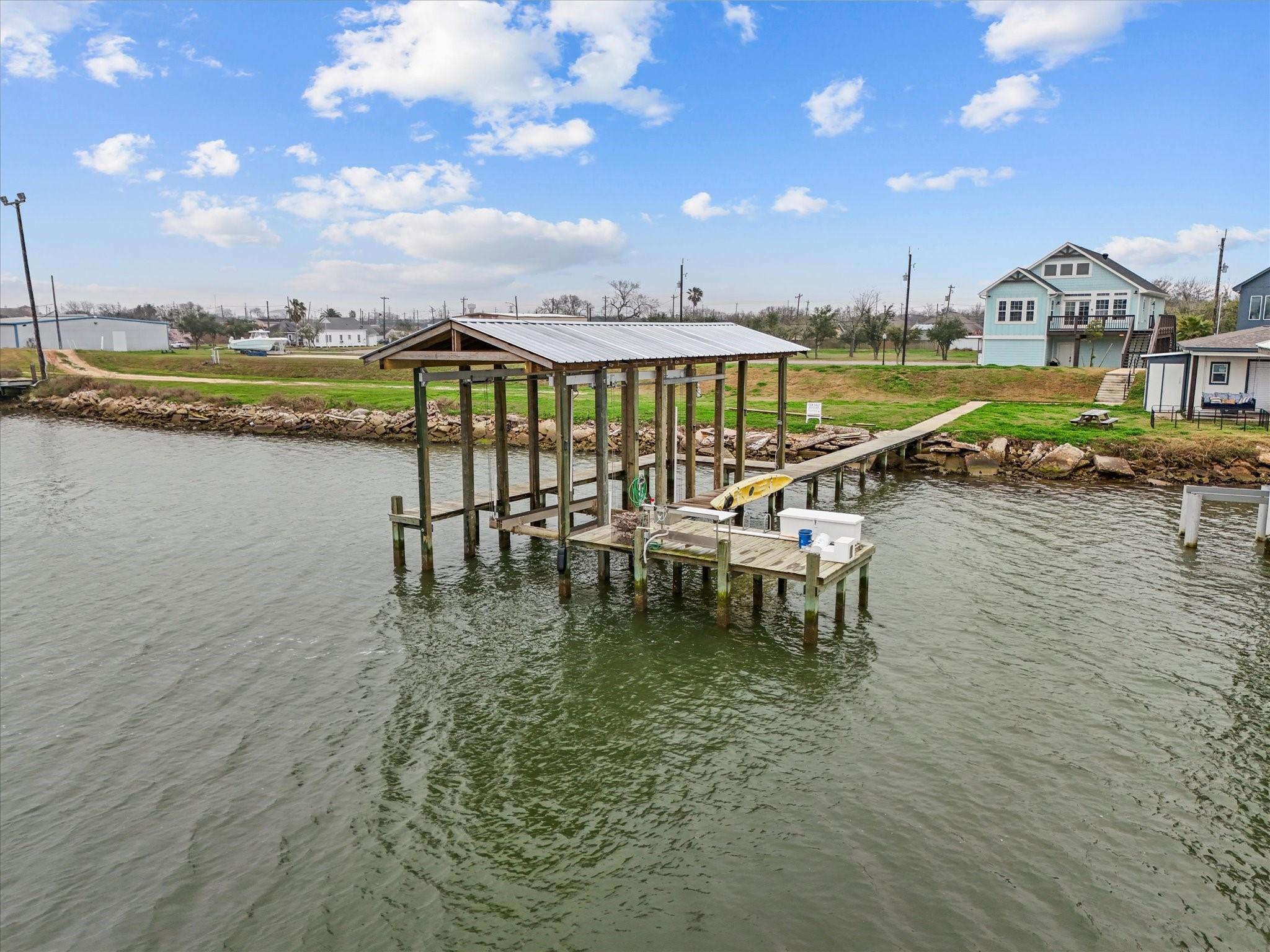 Image 3: This photo showcases a waterfront property with a