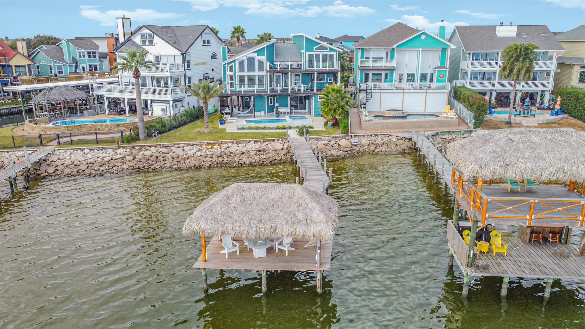 Image 1: Aerial shot of home + pier