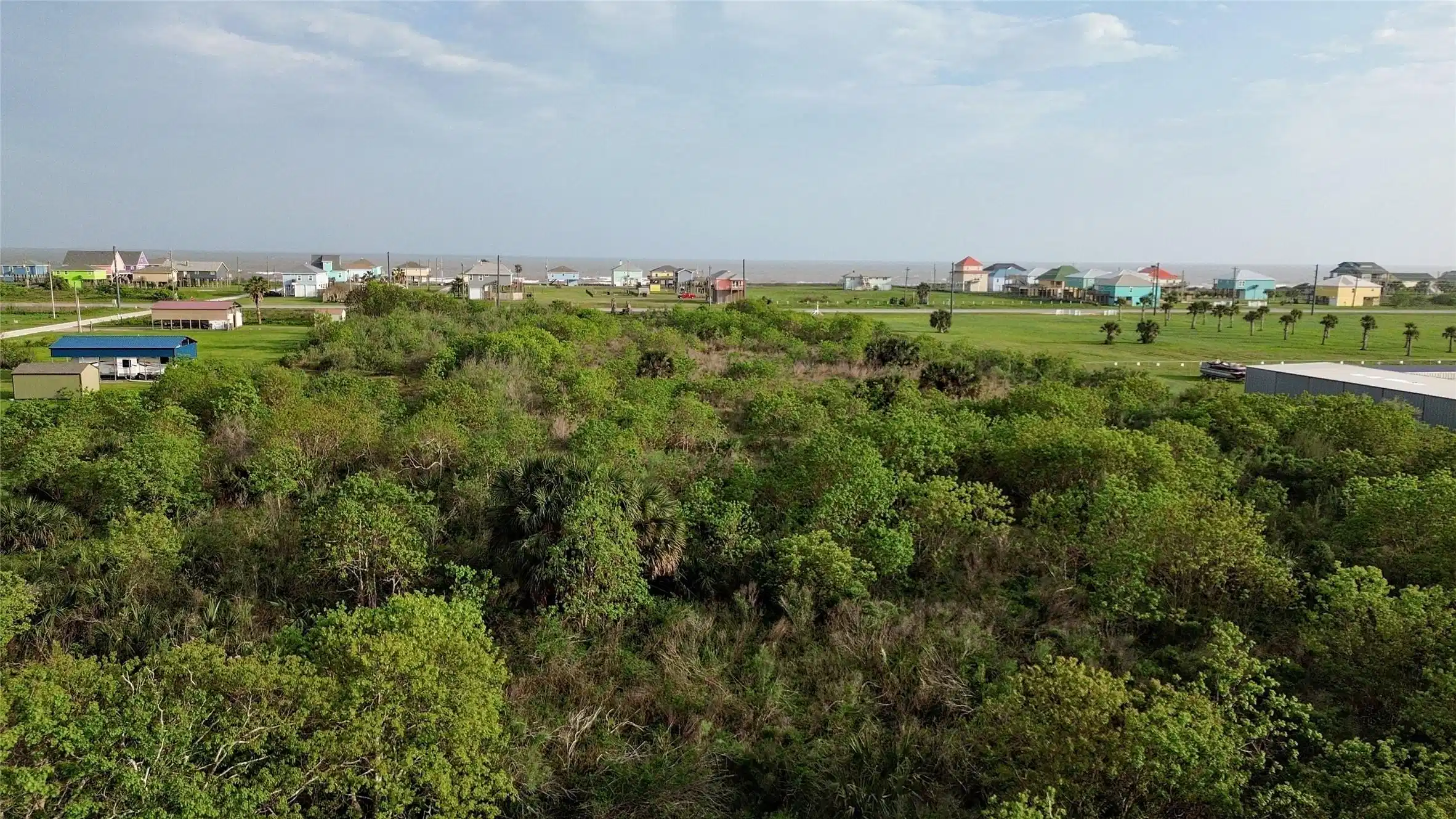 Image 1: View from the back of the lot to the beach. Beach