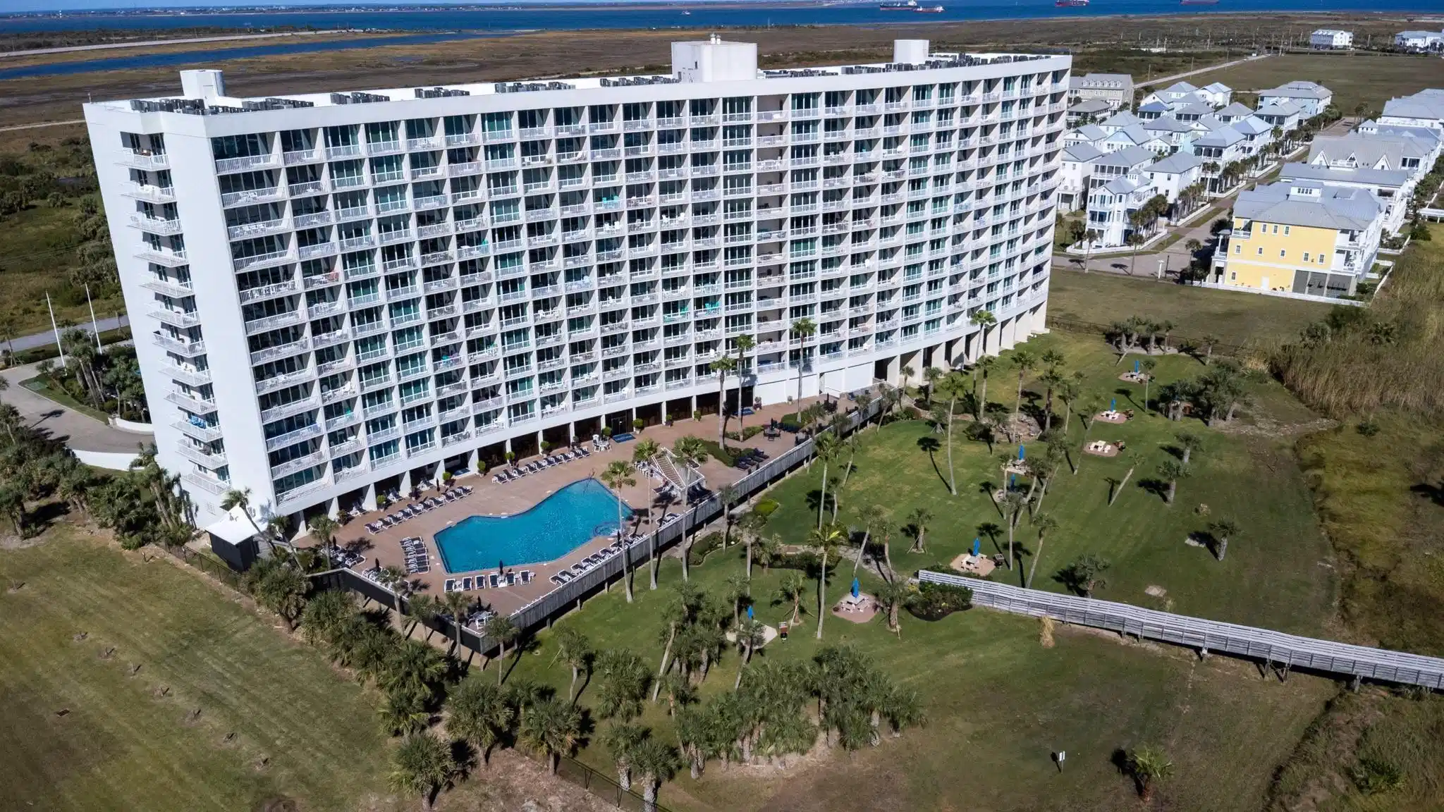 Image 1: The Galvestonian has the 70K HEATED POOL, with wal