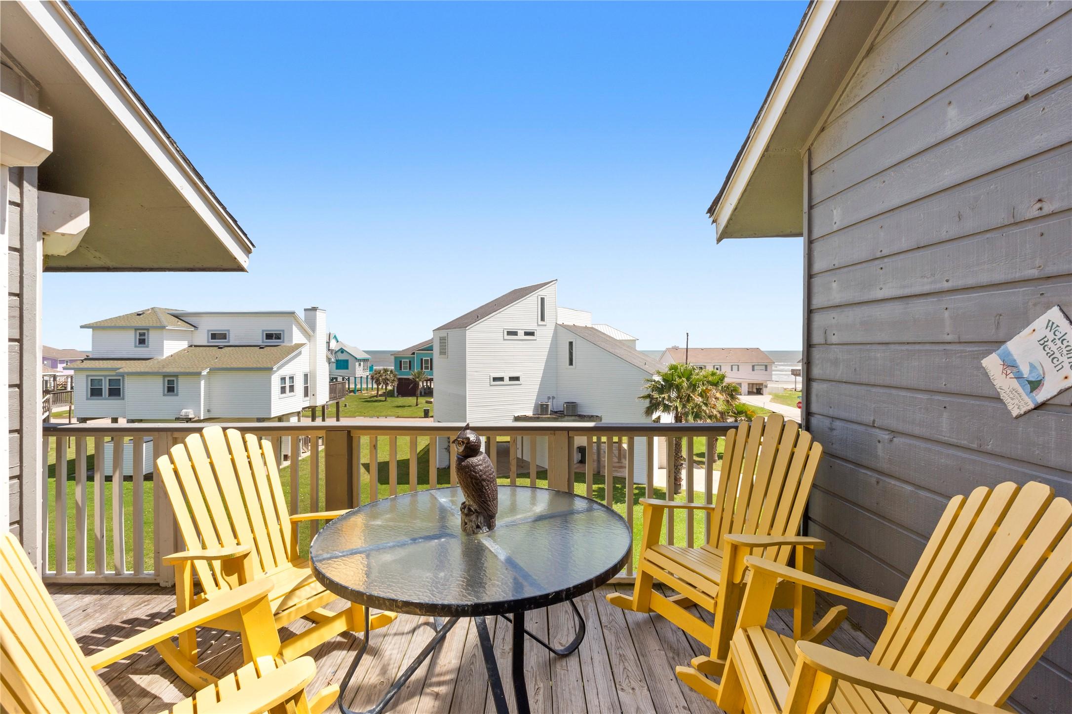 Image 2: Beach views and Gulf breezes from the top floor ba