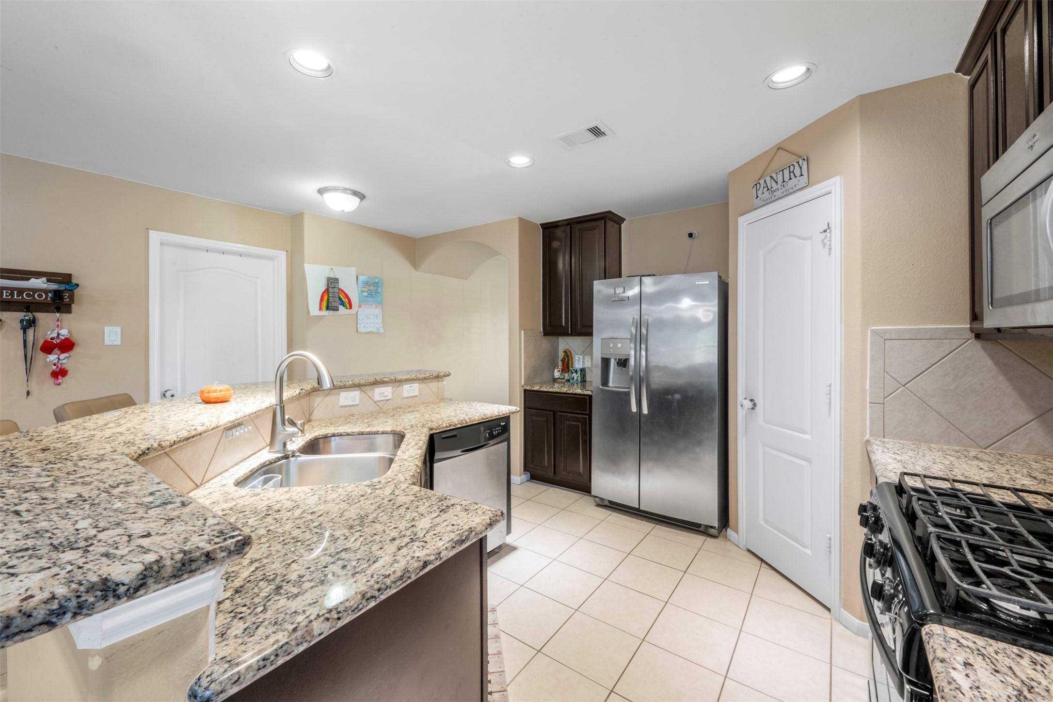 Image 2: Enjoy the open kitchen space and bar for a quick c
